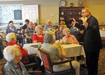 Larry Bergnach, a longtime Free Speakers speaker, presenting to a room of seniors